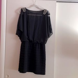Black dress with embellished shoulder detail